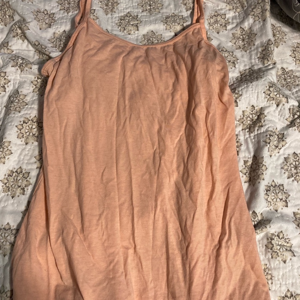 Pink ish tan tank top. Size medium. No damage.